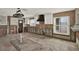 Kitchen featuring tile floor, white cabinets, large sink, and view to open rooms at 3800 Shore Acres Ne Blvd, St Petersburg, FL 33703