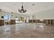 Bright living room featuring tile flooring, recessed lighting, and large windows overlooking water at 3800 Shore Acres Ne Blvd, St Petersburg, FL 33703