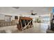 Spacious living room featuring tile floors, white cabinets, and view to the water at 3800 Shore Acres Ne Blvd, St Petersburg, FL 33703