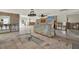 Large living area featuring tile flooring, recessed lights, ceiling fan, and fireplace in background at 3800 Shore Acres Ne Blvd, St Petersburg, FL 33703