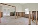 Open room featuring tile flooring, exposed block walls, and light-filled windows with ample renovation possibilities at 3800 Shore Acres Ne Blvd, St Petersburg, FL 33703