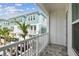 Balcony overlooking a residential area with palm trees and blue townhouses on a sunny day at 448 31St N Ln, St Petersburg, FL 33713