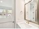 Bathroom featuring quartz countertop vanity, modern fixtures, and large window at 448 31St N Ln, St Petersburg, FL 33713