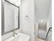 Bathroom featuring quartz countertop vanity, modern fixtures, and an entrance to the basement at 448 31St N Ln, St Petersburg, FL 33713