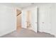 Bright bedroom featuring doorways to a bathroom, closet, and stairway at 448 31St N Ln, St Petersburg, FL 33713