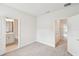 Bright bedroom with ensuite bathroom featuring modern fixtures, and a hallway with closet at 448 31St N Ln, St Petersburg, FL 33713