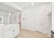 Bright kitchen with white cabinets, stainless steel appliances, and modern pendant lighting at 448 31St N Ln, St Petersburg, FL 33713