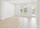 Bright, modern living room with wood-look flooring, recessed lights and lots of natural light at 448 31St N Ln, St Petersburg, FL 33713