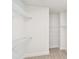 Walk-in closet with built-in white shelving for optimal organization at 448 31St N Ln, St Petersburg, FL 33713