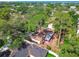 Overhead shot of a cozy home, partially concealed by trees, in a neighborhood near the water at 4711 W Vasconia St, Tampa, FL 33629