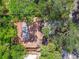 Overhead view captures a property featuring trees and rooftop details at 4711 W Vasconia St, Tampa, FL 33629