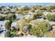 Aerial view showcasing the home's landscaping, pool, and proximity to the waterfront at 4711 W Vasconia St, Tampa, FL 33629