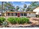 Expansive sunroom offering abundant natural light, with a well-manicured garden enhancing this home's appeal at 4711 W Vasconia St, Tampa, FL 33629