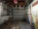 Spacious garage interior with open storage, concrete flooring and a ladder at 4711 W Vasconia St, Tampa, FL 33629
