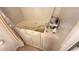Close-up of a walk-in bathtub with safety features, curtain, and chrome faucet at 4851 W Gandy Blvd # 23C, Tampa, FL 33611