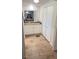 Bathroom featuring an updated vanity with granite countertops, ample storage, and wood-look flooring at 4851 W Gandy Blvd # 23C, Tampa, FL 33611