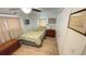 Bedroom with a window, bed and chest of drawers at 4851 W Gandy Blvd # 23C, Tampa, FL 33611