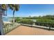 Private deck with a beautiful view of the water and greenery at 4851 W Gandy Blvd # 23C, Tampa, FL 33611