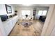 The dining area features updated flooring, natural light, and white wood accents at 4851 W Gandy Blvd # 23C, Tampa, FL 33611