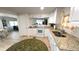 The kitchen has white cabinets, stainless steel sink, and modern appliances at 4851 W Gandy Blvd # 23C, Tampa, FL 33611