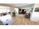 Spacious living room with wood floors, large windows, and comfortable seating at 4851 W Gandy Blvd # 23C, Tampa, FL 33611