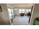 Open-concept living area with wood floors, natural light, and seamless flow between spaces at 4851 W Gandy Blvd # 23C, Tampa, FL 33611