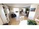 Bright and airy living room with wood floors, a comfortable sofa, and lots of natural light at 4851 W Gandy Blvd # 23C, Tampa, FL 33611