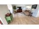 Cozy living room featuring wood floors, comfortable seating, and a traditional area rug at 4851 W Gandy Blvd # 23C, Tampa, FL 33611