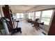 Bright and airy living space featuring wood floors, large windows, and a welcoming atmosphere at 4851 W Gandy Blvd # 23C, Tampa, FL 33611