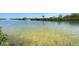 Serene water view with calm, clear water, showcasing a beautiful natural landscape in a peaceful neighborhood at 4851 W Gandy Blvd # 23C, Tampa, FL 33611