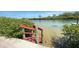 Staircase leading to tranquil waterfront views, offering easy access for outdoor enjoyment at 4851 W Gandy Blvd # 23C, Tampa, FL 33611