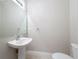 Powder room with pedestal sink and tiled floors at 5048 Sunridge Palms Dr # 103, Tampa, FL 33617