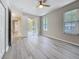 Airy bedroom with vinyl flooring, natural light, and access to the outdoor patio at 5048 Sunridge Palms Dr # 103, Tampa, FL 33617