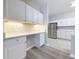 Well-lit kitchen with white cabinets, quartz countertops, and stainless steel appliances at 5048 Sunridge Palms Dr # 103, Tampa, FL 33617