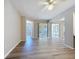 Spacious living room with luxury vinyl floors, neutral walls, and abundant natural light at 5048 Sunridge Palms Dr # 103, Tampa, FL 33617