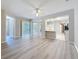 Open floor plan with large sliding glass doors and modern vinyl flooring at 5048 Sunridge Palms Dr # 103, Tampa, FL 33617