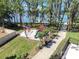 Aerial view of the playground shows a slide, swings, climbing structure, and lake in the background at 5101 Corvette Dr, Tampa, FL 33624