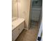 Bathroom featuring a sink, vanity, and shower with updated tile at 5101 Corvette Dr, Tampa, FL 33624