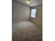 Large bedroom with vaulted ceiling features a ceiling fan and a window for natural light at 5101 Corvette Dr, Tampa, FL 33624
