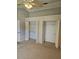 Spacious bedroom boasting ample closet space and a ceiling fan for added comfort at 5101 Corvette Dr, Tampa, FL 33624