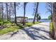 Community outdoor area with gazebo, picnic tables, grill and lake access for all residents at 5101 Corvette Dr, Tampa, FL 33624