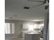 Bright kitchen features white cabinets, an island, stainless steel appliances and lots of counter space at 5101 Corvette Dr, Tampa, FL 33624