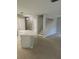 Open-concept living room and kitchen with granite island and tiled floors at 5101 Corvette Dr, Tampa, FL 33624