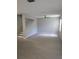 Open living room with tiled floors, stairs, ceiling fan, and bright windows at 5101 Corvette Dr, Tampa, FL 33624