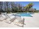 Beautiful pool with lounge chairs and a great spot to sit and read a book or enjoy the sun at 5101 Corvette Dr, Tampa, FL 33624