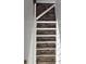 Modern staircase with white risers and attractive dark wood treads at 5101 Corvette Dr, Tampa, FL 33624