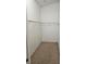 Walk-in closet with wire shelving, carpeted floor and white walls ready to be organized at 5101 Corvette Dr, Tampa, FL 33624