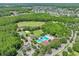 Aerial view showcasing the community pool, golf course, and surrounding lush landscape at 5340 Riva Ridge Dr, Wesley Chapel, FL 33544