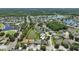 Aerial view of a home in a neighborhood with lakes and lush greenery at 5340 Riva Ridge Dr, Wesley Chapel, FL 33544