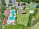 Aerial view of the recreation area featuring a pool, picnic tables, playground, sports courts, and parking at 5340 Riva Ridge Dr, Wesley Chapel, FL 33544